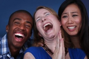 Three laughing people