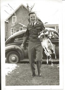 A happy WWII Veteran, Alex Lutkevich, returning home to his bride.